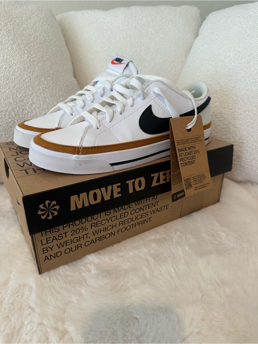 Nike Menโs White Sneakers with Black Swoosh & Brown Trim